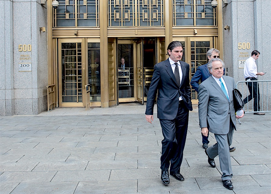 Hillel Nahmad, left, known as Helly, leaves a federal courthouse in New York, April 19, 2013