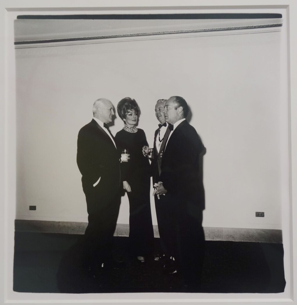 Diane Arbus Four people at a gallery opening, N.Y.C. 1968 1968. Gelatin silver print. Printed by Diane Arbus 1968-1970. Signed verso in ink by Doon Arbus for the Estate of Diane Arbus; estate stamp verso