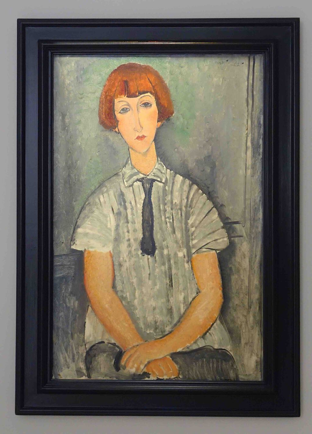 Amedeo Modigliani Jeune fille à la chemise rayée 1917. Oil on canvas, 92 x 60 cm @ Helly Nahmad gallery