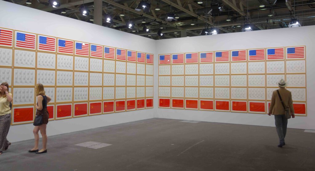Hanne Darboven Ost-West-Demokratie 1983. Felt-tip pencil on postcards and paper, flags of the USA, FRG, GDR, and Soviet Union made of fabric, and photographs; 190 parts, 50 x 70 cm each @ Kewenig, Art Basel Unlimited