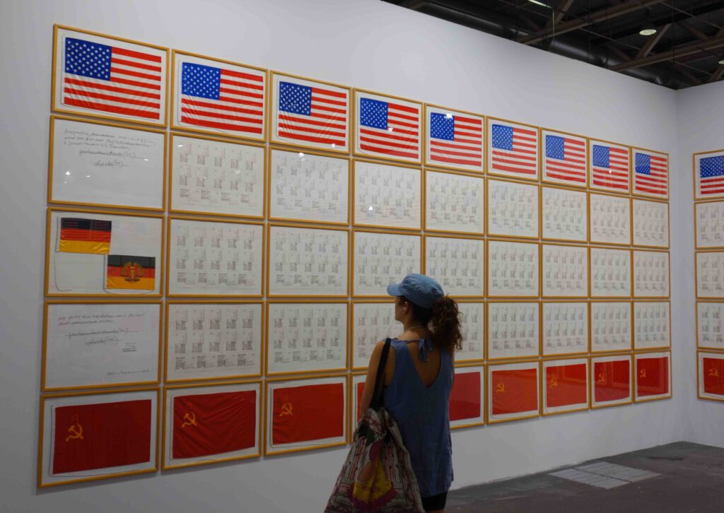 Hanne Darboven Ost-West-Demokratie 1983. Felt-tip pencil on postcards and paper, flags of the USA, FRG, GDR, and Soviet Union made of fabric, and photographs; 190 parts, 50 x 70 cm each @ Kewenig, Art Basel Unlimited