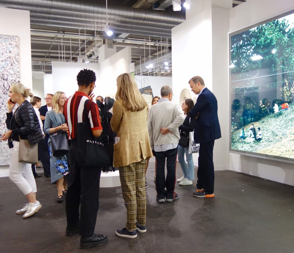 Kenny Schachter talking to Auctioneer and Chairman of Sotheby’s Europe Oliver Parker @ White Cube booth, Art Basel 2024