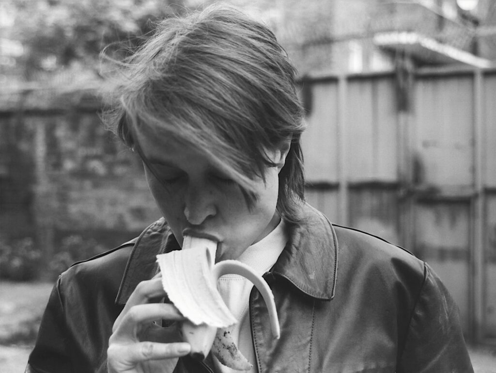 EATING A BANANA (FOR GRENFELL) by Sarah Lucas 1990-2017. This work is unique, plus 1 artist’s proof. 67.6 x 90 cm, photograph.