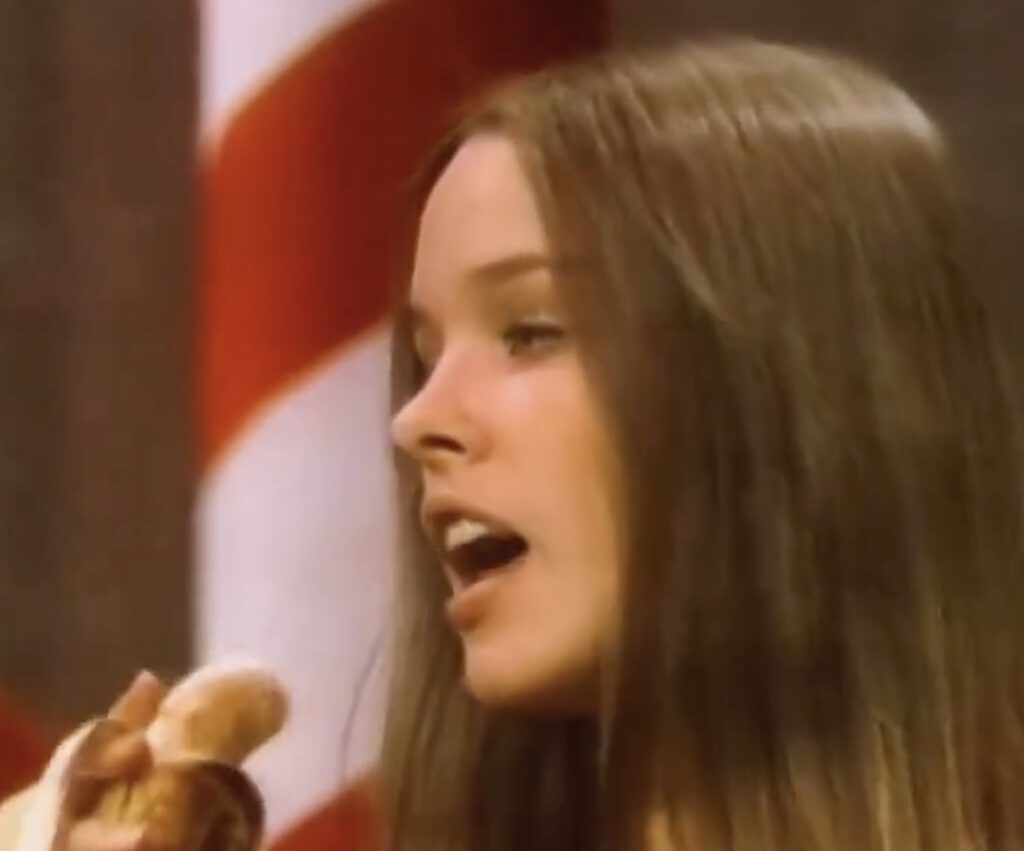 In 1967, Michelle Phillips (23) of The Mamas & the Papas, forced to lip-sync on The Ed Sullivan Show.
